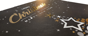 Carte de vœux de Noël noire avec dorure à chaud et finitions de luxe par Pixelpub.ch.